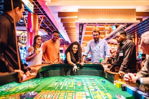group of people playing craps at L'Auberge